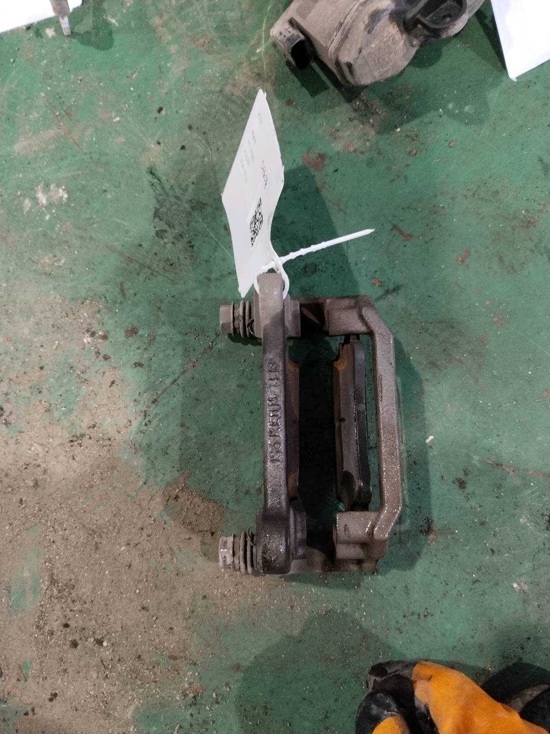 L8W0615425 Rear Brake Caliper Bracket, Left