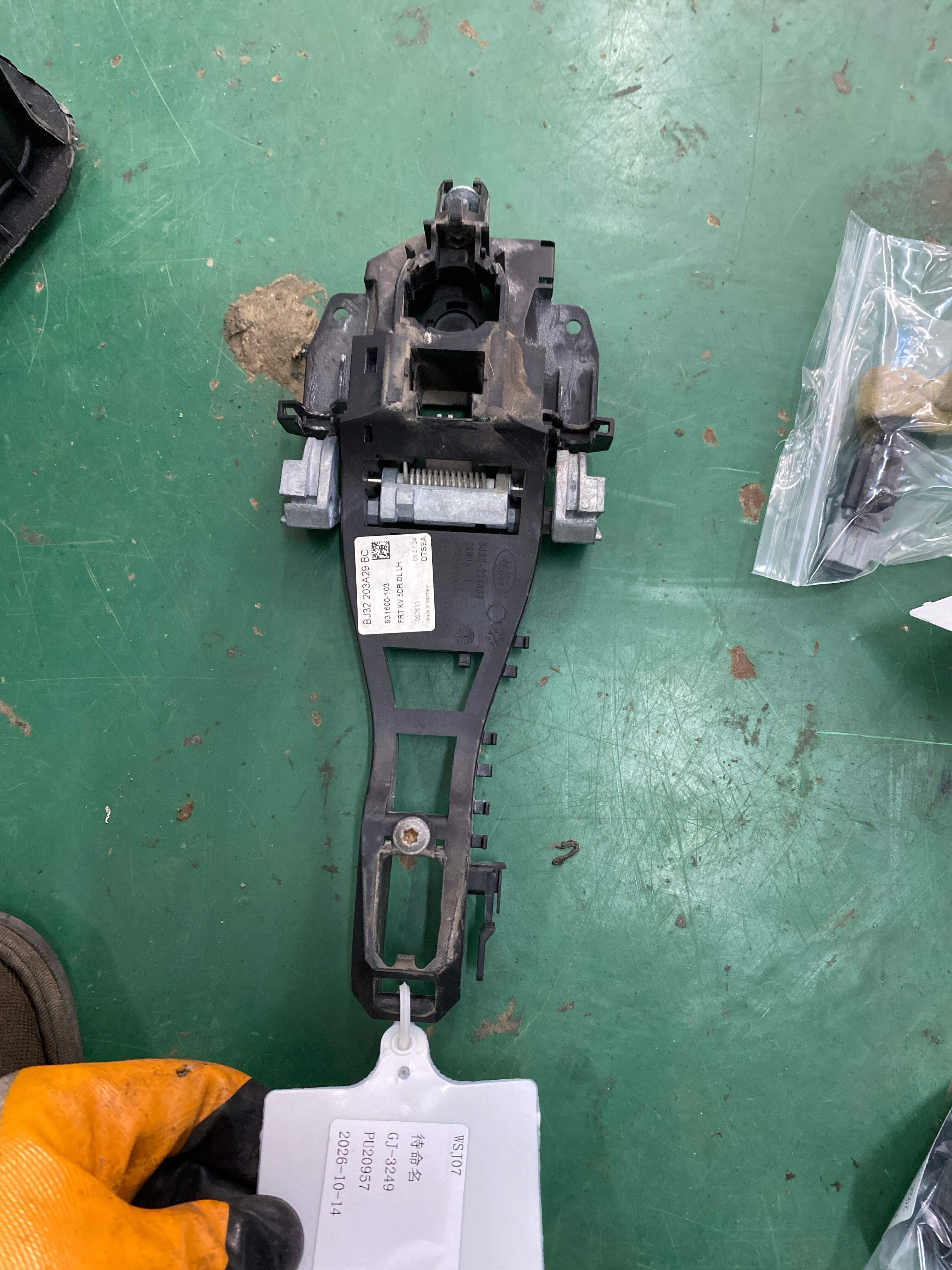 LR025541 Front Door Outer Handle Mounting Frame, Left