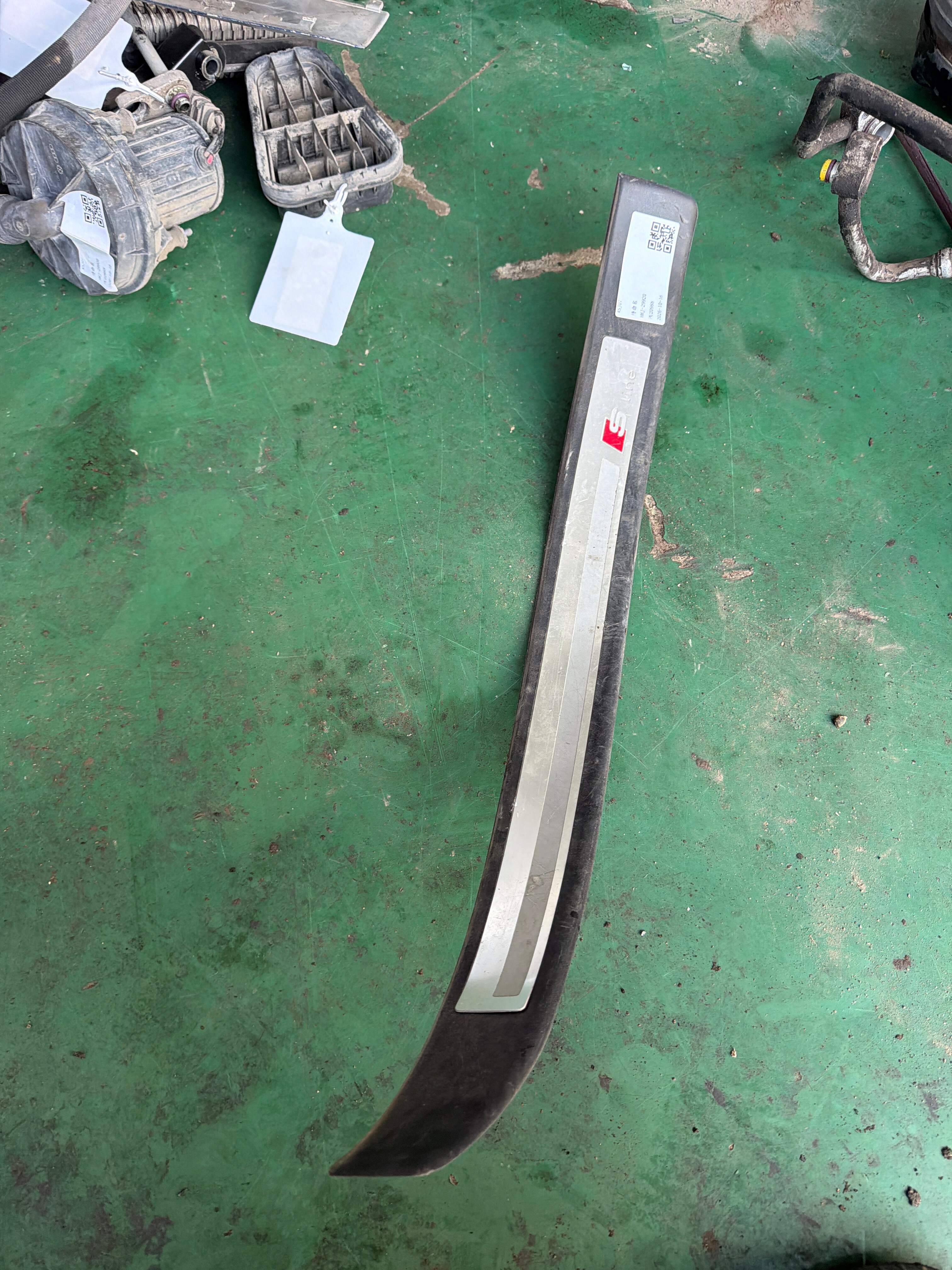 8E0853373G Front Door Sill Trim Panel, Left
