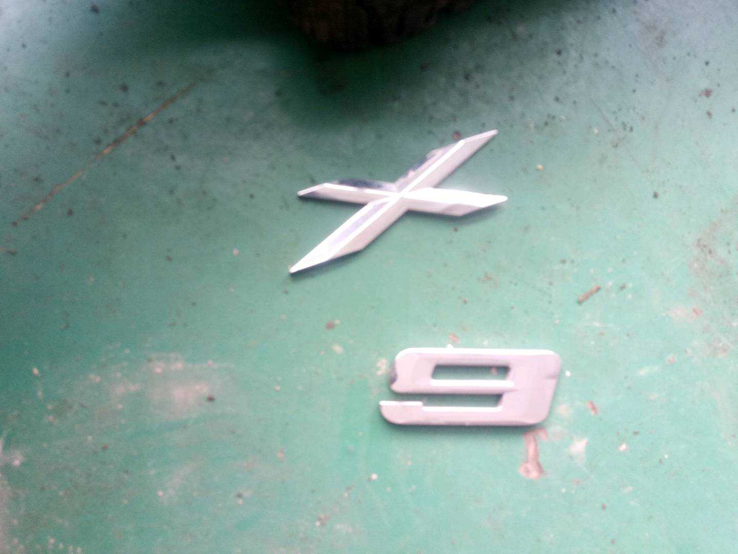 51147196556 Tailgate Emblem (Model Name)