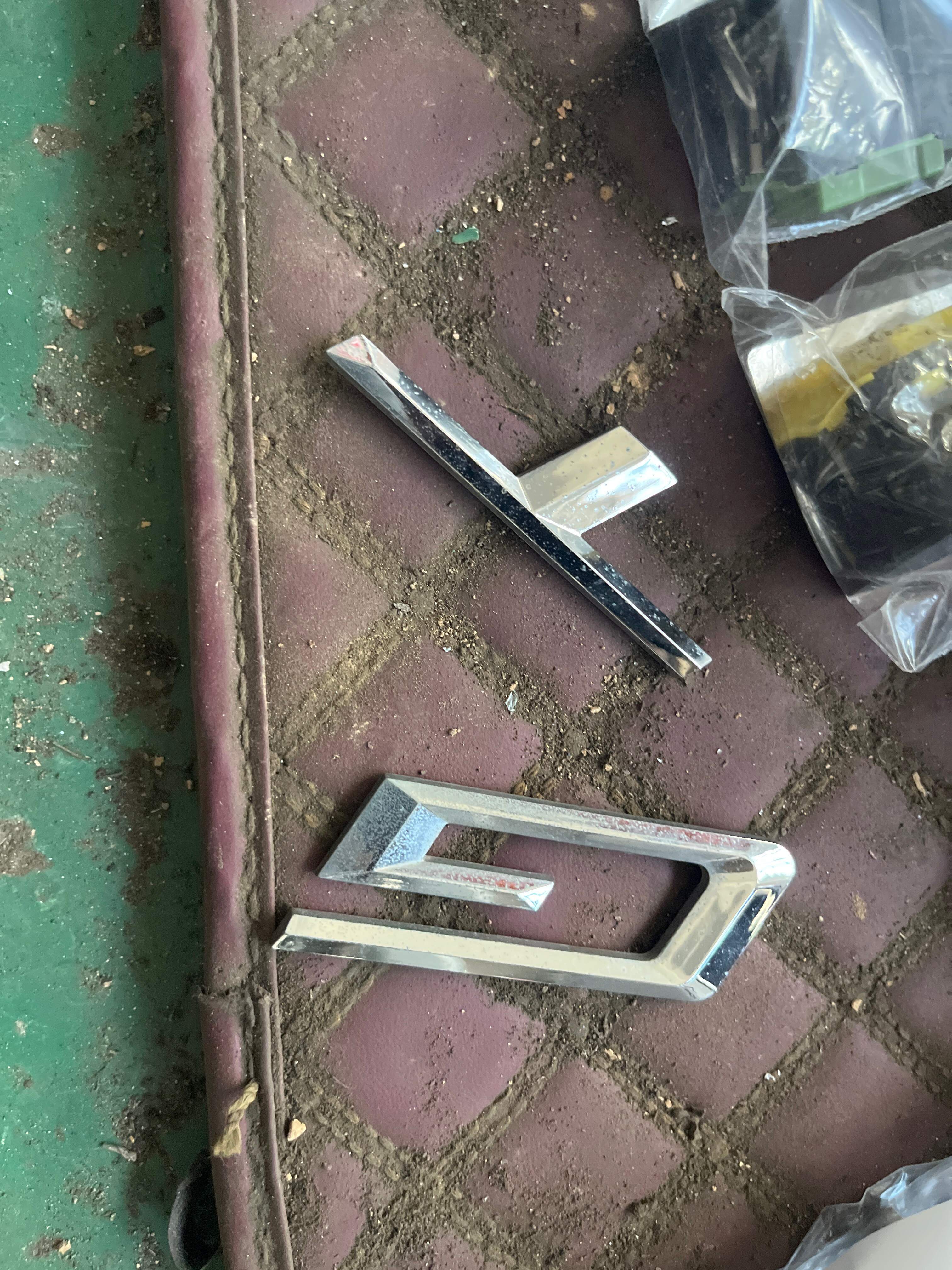 51147239730 Tailgate Emblem (Model Name)
