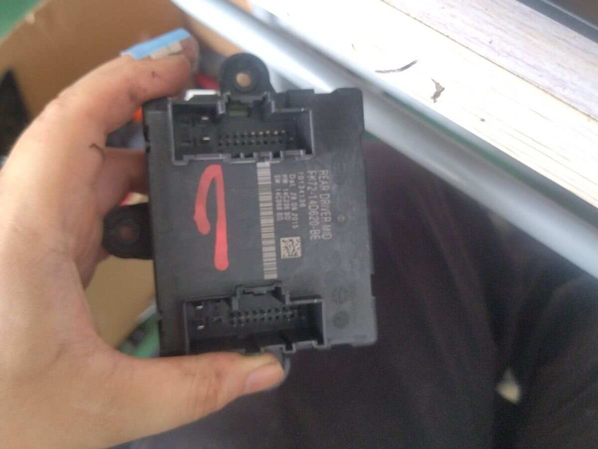 T4N6267 Rear Door Control Unit, Left
